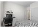 Bright bedroom features a batman themed bed, hardwood floors, a desk, and a walk in closet at 9053 Boston Springs Ave, Las Vegas, NV 89149