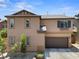 Charming home featuring a two-car garage and manicured landscaping at 9053 Boston Springs Ave, Las Vegas, NV 89149