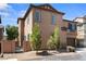 Two-story home featuring an attached two-car garage and low maintenance landscaping with desert plants at 9053 Boston Springs Ave, Las Vegas, NV 89149