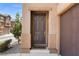 Inviting front entrance featuring a contemporary door, two-car garage and low maintenance yard at 9053 Boston Springs Ave, Las Vegas, NV 89149