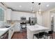 Modern kitchen boasts quartz counters, stainless appliances, and white cabinetry at 9053 Boston Springs Ave, Las Vegas, NV 89149