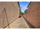 Side yard with desert landscaping and a brick wall at 9053 Boston Springs Ave, Las Vegas, NV 89149
