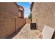 Low maintenance side yard with stone ground cover and block wall, offering a practical design at 9053 Boston Springs Ave, Las Vegas, NV 89149