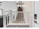Carpeted staircase with white railing leading to the upper level at 9053 Boston Springs Ave, Las Vegas, NV 89149