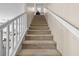 Carpeted staircase with white railing leading to the upper level of the home at 9053 Boston Springs Ave, Las Vegas, NV 89149