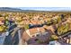 A residential neighborhood shows earth tone landscaping with houses and a covered patio at 9105 Marble Dr, Las Vegas, NV 89134