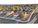 Aerial view of a home in a residential neighborhood, featuring a well-maintained yard and mature trees at 9105 Marble Dr, Las Vegas, NV 89134