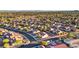 High aerial shot showcasing a dense suburban neighborhood with tree-lined streets and well-kept homes at 9105 Marble Dr, Las Vegas, NV 89134