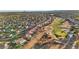 Expansive aerial view of a residential area adjacent to a verdant golf course at 9105 Marble Dr, Las Vegas, NV 89134