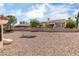 Large backyard featuring rock landscaping and mature trees providing shade and privacy at 9105 Marble Dr, Las Vegas, NV 89134