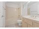 Bathroom with a shower-tub combo, updated fixtures and a wood vanity with countertop at 9105 Marble Dr, Las Vegas, NV 89134