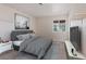 Calm bedroom with a large window, minimalist decor, and a spacious layout for a relaxing retreat at 9105 Marble Dr, Las Vegas, NV 89134