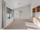 Bedroom with large windows, built-in shelving and beige carpet at 9105 Marble Dr, Las Vegas, NV 89134