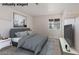 Cozy bedroom with a queen bed, neutral paint, and plenty of natural light at 9105 Marble Dr, Las Vegas, NV 89134