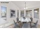 Dining area featuring large windows, neutral paint, and chandelier lighting at 9105 Marble Dr, Las Vegas, NV 89134