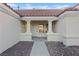 Inviting front entrance with classic white columns and tiled walkway, creating an elegant arrival at 9105 Marble Dr, Las Vegas, NV 89134