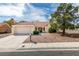Charming single-story home with a two-car garage, tile roof, and well-kept desert landscaping at 9105 Marble Dr, Las Vegas, NV 89134
