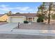 Charming single-story home featuring a well-maintained yard, two-car garage, and inviting front entrance at 9105 Marble Dr, Las Vegas, NV 89134