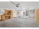 Spacious garage with built-in shelving, work bench, and overhead storage racks at 9105 Marble Dr, Las Vegas, NV 89134