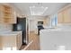Well-lit kitchen with light wood cabinets, a skylight, stainless steel appliances, and a breakfast bar at 9105 Marble Dr, Las Vegas, NV 89134