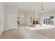 Open-concept living area with carpet, tile flooring, and a brick fireplace at 9105 Marble Dr, Las Vegas, NV 89134