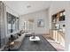 Stylish living room featuring modern furniture, large windows, and built-in shelving, perfect for relaxing at 9105 Marble Dr, Las Vegas, NV 89134