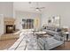 Bright living room featuring a cozy fireplace, sliding glass doors, and modern decor with comfortable seating at 9105 Marble Dr, Las Vegas, NV 89134