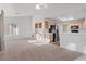 Bright, open-concept living room flowing into the kitchen, featuring neutral tones and ample natural light at 9105 Marble Dr, Las Vegas, NV 89134