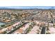 Neighborhood aerial featuring residential homes with private pools and lush, desert landscaping at 9205 Desert Village Ave, Las Vegas, NV 89147