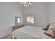 Bright bedroom with dresser, window and ceiling fan at 9205 Desert Village Ave, Las Vegas, NV 89147