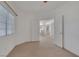 Bedroom features an open doorway to dining area at 9205 Desert Village Ave, Las Vegas, NV 89147