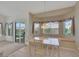 Bright dining area boasts a comfortable window bench and seamless access to the outdoor patio at 9205 Desert Village Ave, Las Vegas, NV 89147