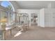 Bright dining room boasting high ceilings, a large window, and neutral carpeting at 9205 Desert Village Ave, Las Vegas, NV 89147