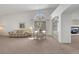Bright, spacious dining area featuring carpet flooring, and natural lighting at 9205 Desert Village Ave, Las Vegas, NV 89147