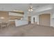 Bright, open kitchen with breakfast bar, white appliances, and access to a dining area at 9205 Desert Village Ave, Las Vegas, NV 89147