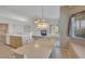 Bright open kitchen boasts lots of counter space, modern appliances, and access to Gathering room at 9205 Desert Village Ave, Las Vegas, NV 89147