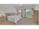 Tranquil main bedroom has plush carpet, dual windows, and a coordinated furniture set at 9205 Desert Village Ave, Las Vegas, NV 89147