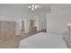 Expansive main bedroom offers a tranquil space with carpet, an ensuite, and classic furniture at 9205 Desert Village Ave, Las Vegas, NV 89147