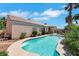 Enjoy a private backyard pool perfect for relaxation and outdoor entertaining with desert landscaping at 9205 Desert Village Ave, Las Vegas, NV 89147