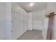 Spacious storage room featuring a long wall of white built in cabinets at 9205 Desert Village Ave, Las Vegas, NV 89147