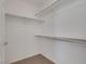 Spacious walk-in closet with metal racks and neutral carpet at 9205 Desert Village Ave, Las Vegas, NV 89147