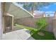 The backyard has low-maintenance landscaping, a covered patio and privacy fence at 927 Clear Diamond Ave, Las Vegas, NV 89123