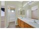 Bathroom featuring double sinks, updated vanity, and bathtub in view at 927 Clear Diamond Ave, Las Vegas, NV 89123