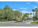 The neighborhood has a decorative gated entrance, mature trees, and lush landscaping at 927 Clear Diamond Ave, Las Vegas, NV 89123
