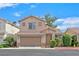 Charming two-story home featuring a 2-car garage and well-maintained landscaping at 927 Clear Diamond Ave, Las Vegas, NV 89123