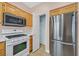 Modern kitchen with stainless steel refrigerator, and ample storage space at 927 Clear Diamond Ave, Las Vegas, NV 89123