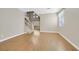 Spacious living area with gleaming hardwood floors and staircase access at 927 Clear Diamond Ave, Las Vegas, NV 89123