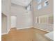 Bright living room with high ceilings, large window, and hardwood floors at 927 Clear Diamond Ave, Las Vegas, NV 89123