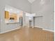 Open-concept living room and kitchen area with hardwood flooring and natural light at 927 Clear Diamond Ave, Las Vegas, NV 89123