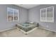 Bedroom with two windows, a bed, and neutral colors, offering a serene and relaxing atmosphere at 9840 Chief Sky St, Las Vegas, NV 89178